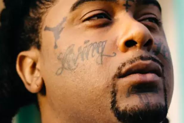 „Greedo Living“ legendinė veido tatuiruotė