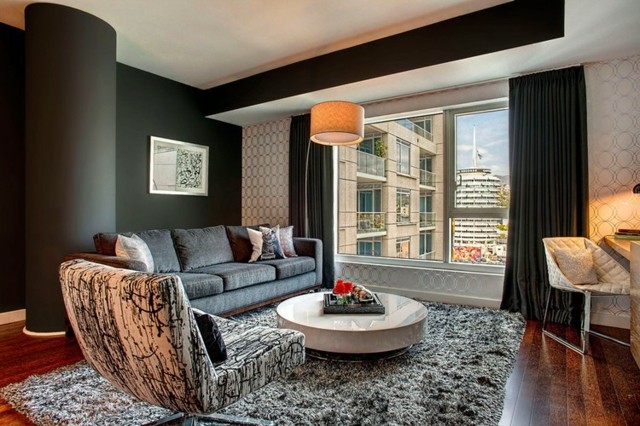 Mobilarea unui apartament sufragerie masă rotundă covor alb culoare antracit
