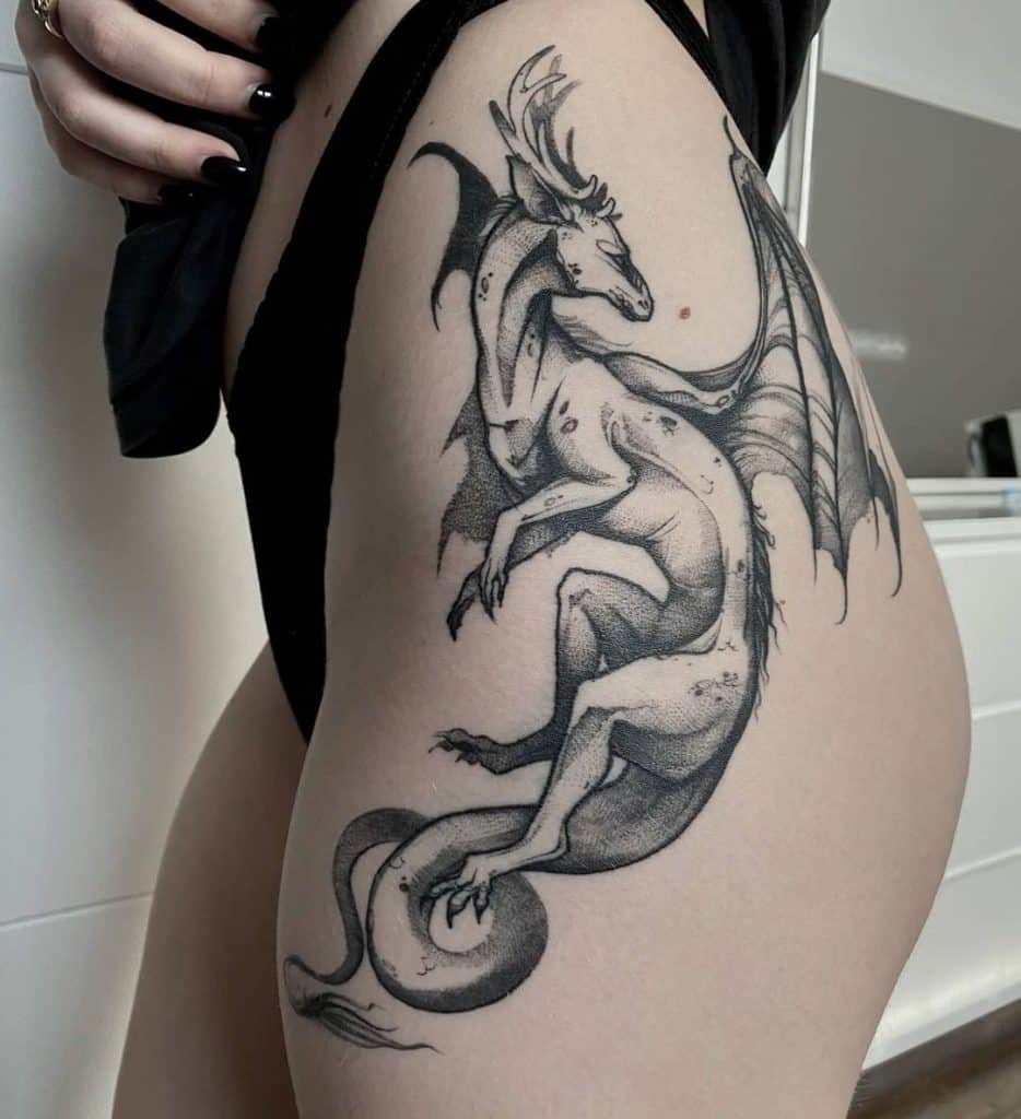 Black Ink Dragon Hip Tattoo