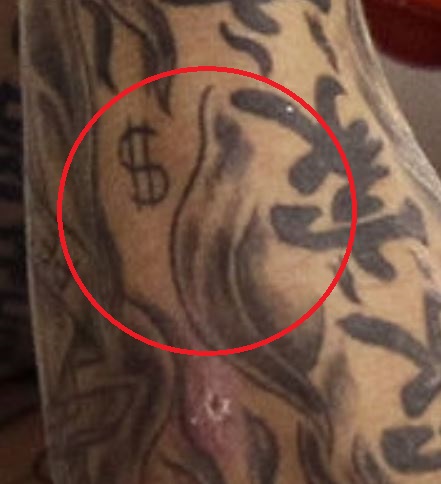 Tatouage de dollar d'Aaron