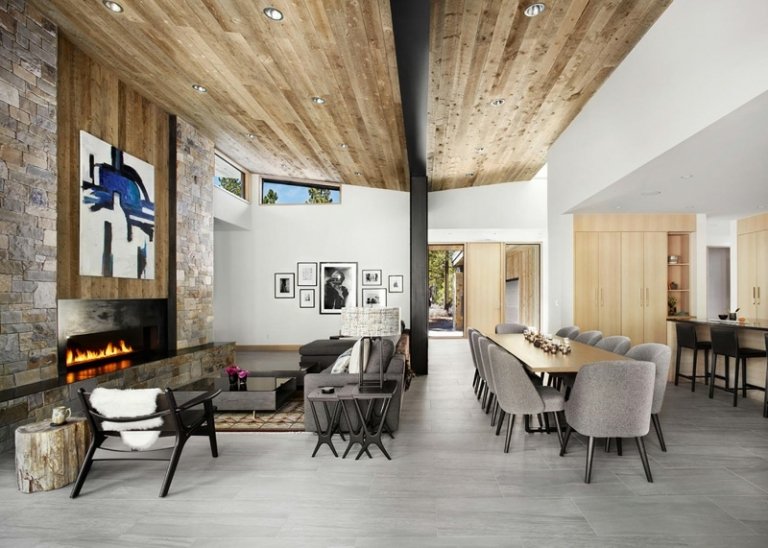 Perete de accent din piatră în zona de living accent perete piatră zonă de living idee șemineu mobilier gri masă masă