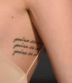 Behati Side Writing Tattoo