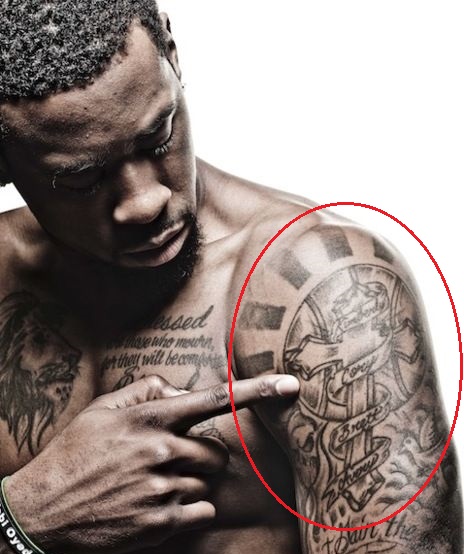 DeAndre Jordan bras gauche croix tatouage