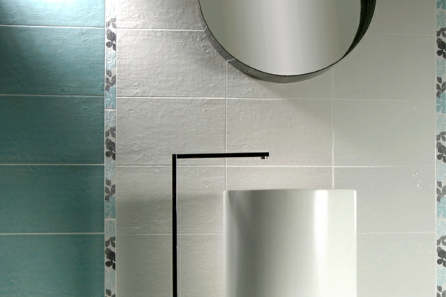 Chiuvetă asemănătoare unui cilindru. Oglindă de perete, optică rotundă, haptică. Gresie în baie Gresie pentru baie cu aspect haptic