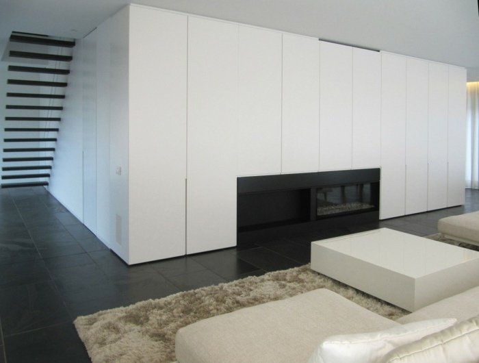 Design de casă în Belgia, cu un perete alb în stil modern living living casa design canapea scaun semineu perete incorporat alb