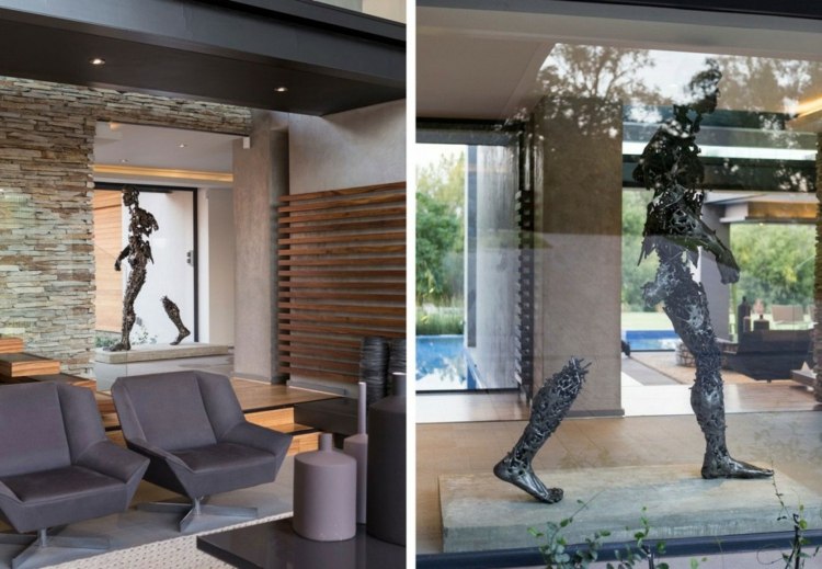 O statuie originală din metal servește drept decor interior interior realizat din materiale naturale mobilier fotoliu negru sculptură modern