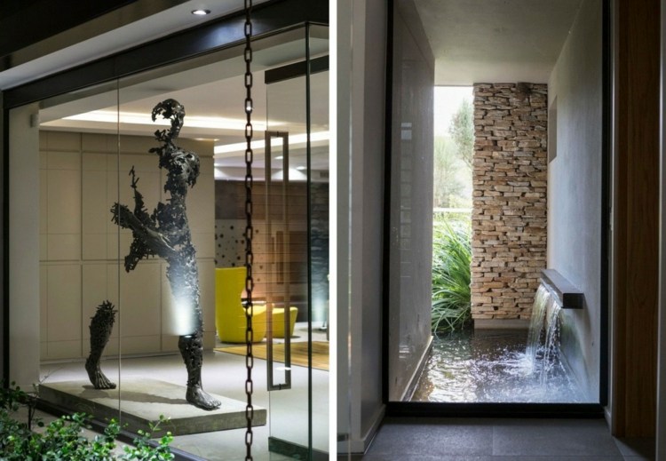 Această cascadă creează o ambianță naturală care poate fi observată din interior interior realizat din materiale naturale art modern metal cascadă stâlp piatră