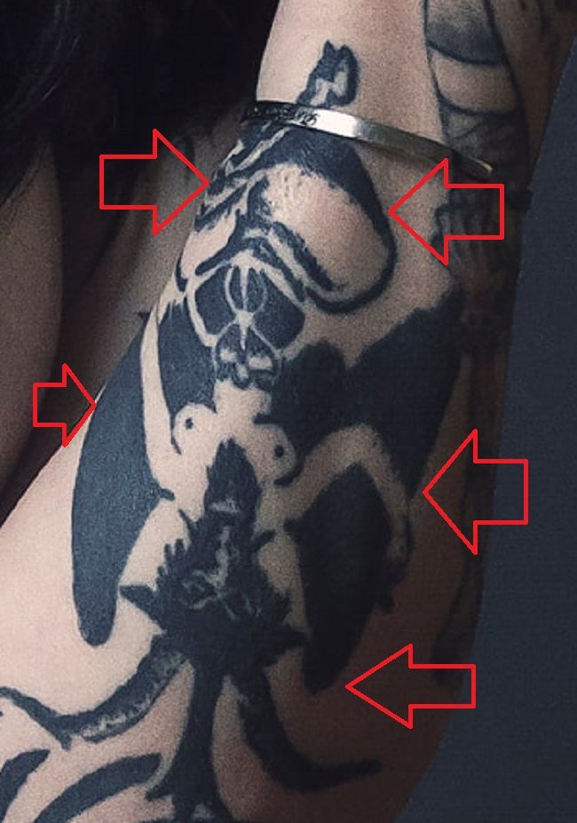 Tatuagem de Ophelia Rain no braço esquerdo