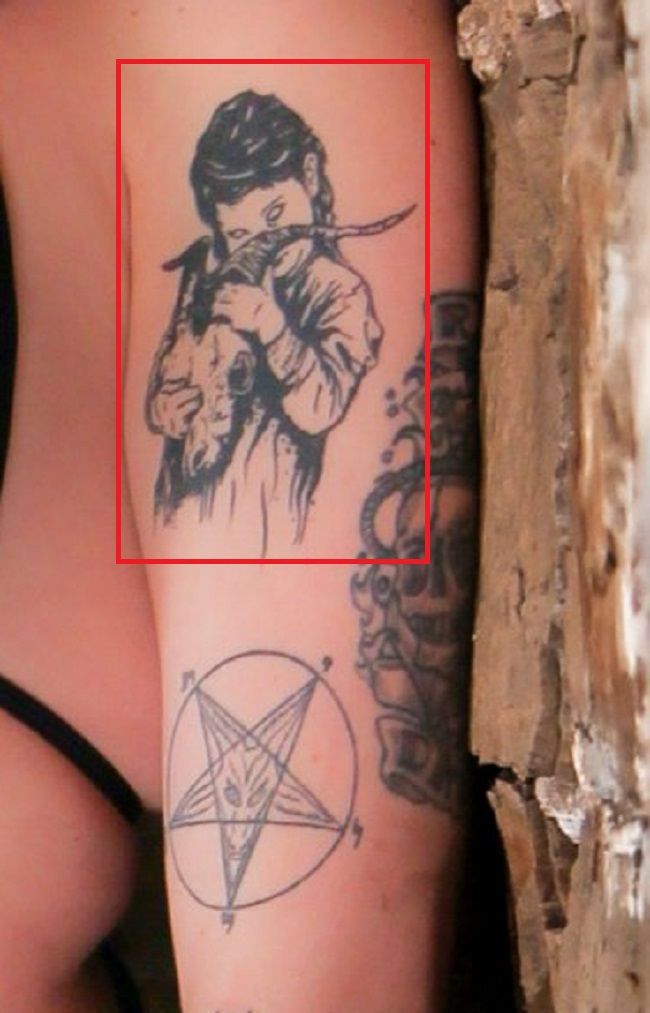 Tatuagem de Ophelia Rain no braço esquerdo