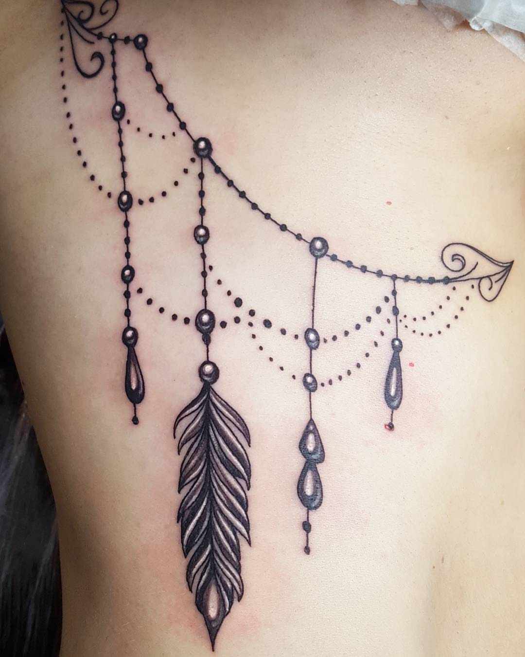 Designul tatuajului cu pene înseamnă tatuaj idei de femeie mică tendințe de tatuaj