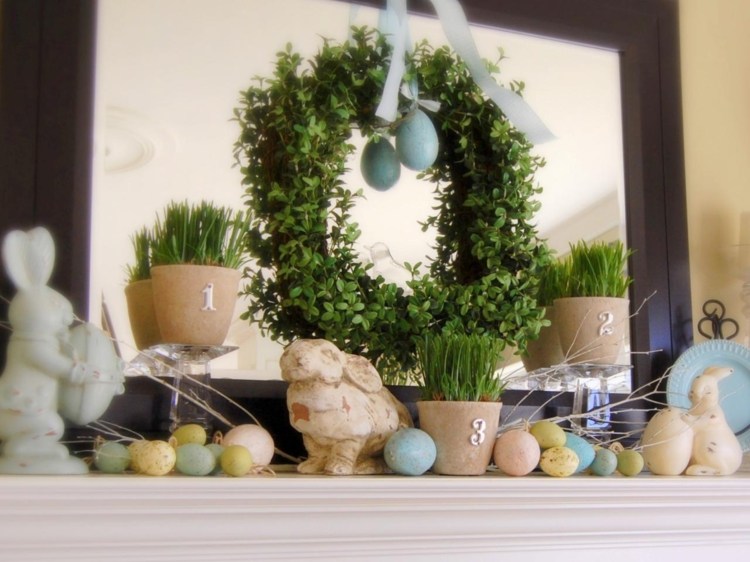 decor de Paște lângă șemineu plante-verzi-decor-ouă-iarbă-cunună