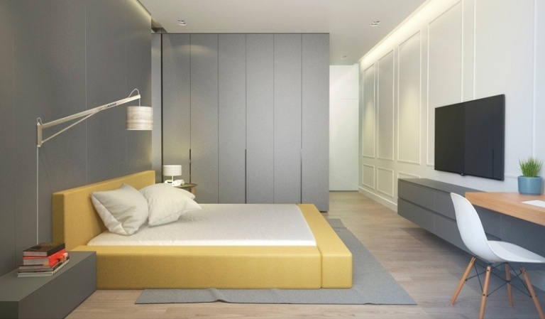 dormitor modern cu un design simplu și funcțional idei-design-interior-gri-galben-dormitor-pat-perete-panouri-tv