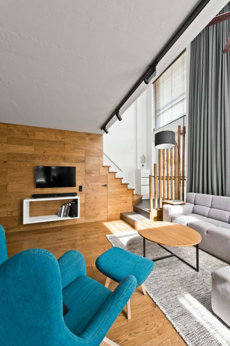 Stilul scandinav este subliniat de lemn Stil scandinav gri amenajare interioară idee canapea masă lemn rotund