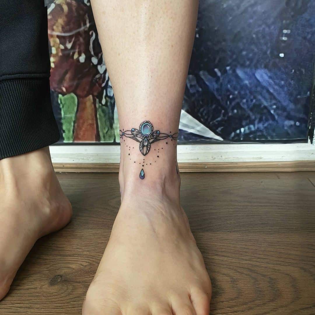 Braccialetto gamba caviglia tatuaggio gemma blu