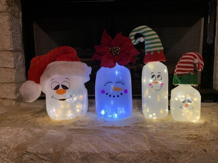 Felinarul omului de zăpadă cu copiii făcând instrucțiuni