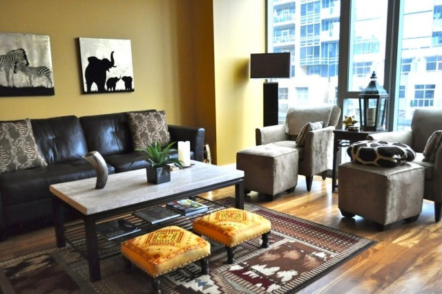 Decor modern de apartamente de inspirație africană-idei-perete galben nisipos Decor-interior-în-stil-Africa-model-covoare-piele-fotoliu-negru
